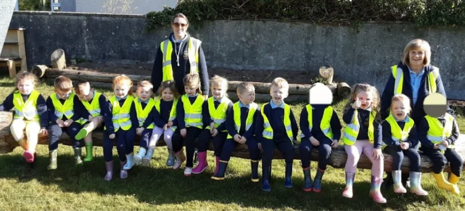 Preschool children and staff from Kilrea Community Early Years taking part in outdoor play and learning activities