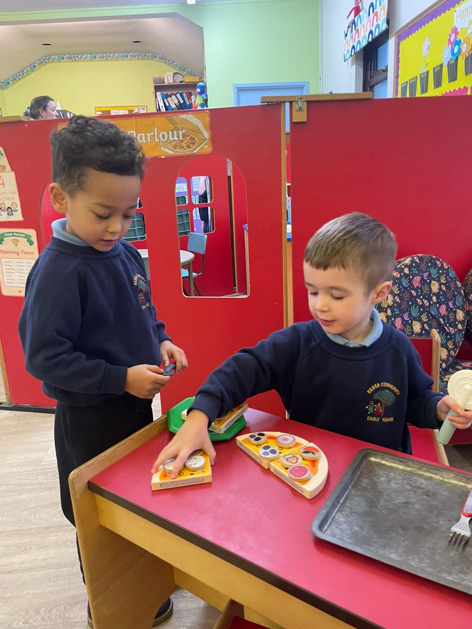 Children building friendships through group play at KCEY